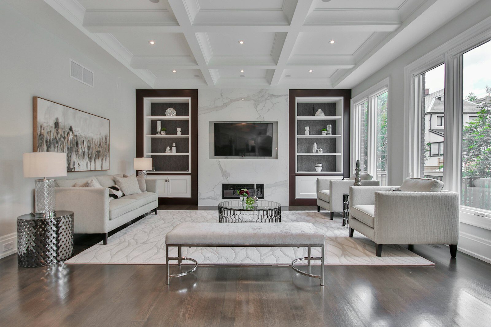 Elegant living room with coffered ceiling, smooth walls and fresh white trim